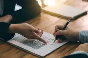lawyer headhunter signing a contract